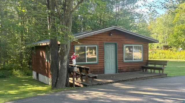 view of outdoor structure with a wooded view