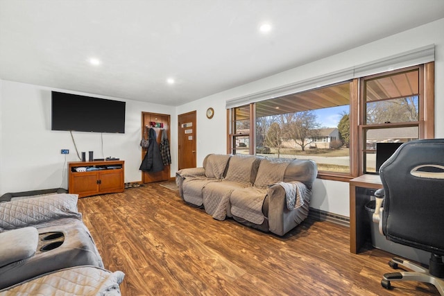 living area with recessed lighting, wood finished floors, and baseboards