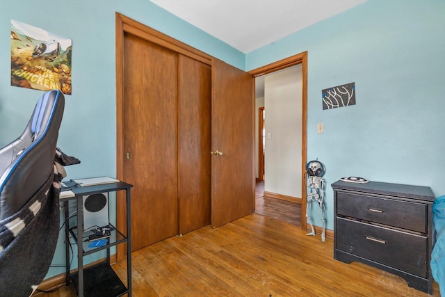 office with baseboards and wood-type flooring