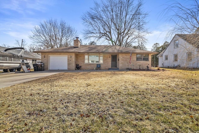 ranch-style home featuring an attached garage, brick siding, driveway, and a chimney