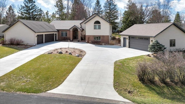 view of front of home with brick siding and a front lawn