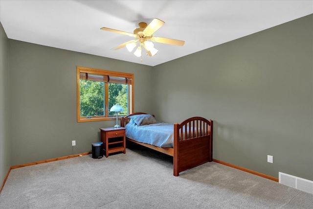 bedroom with visible vents, carpet flooring, a ceiling fan, and baseboards