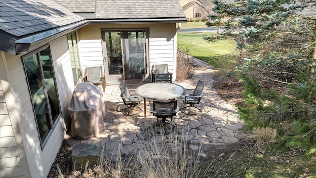 view of patio featuring a grill