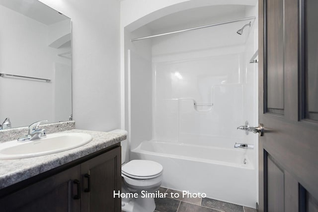 full bathroom featuring toilet, vanity, and shower / tub combination