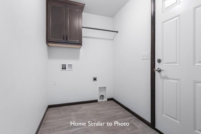 laundry room with baseboards, cabinet space, hookup for an electric dryer, and washer hookup