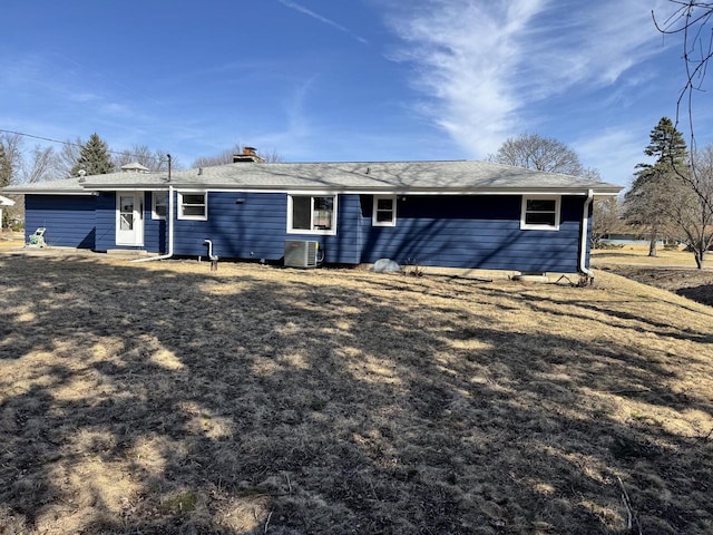 rear view of house with central air condition unit