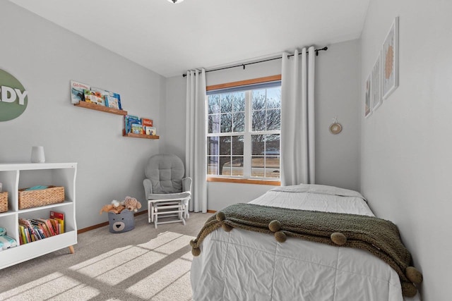 carpeted bedroom with baseboards