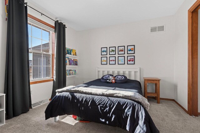 bedroom with carpet, visible vents, and baseboards