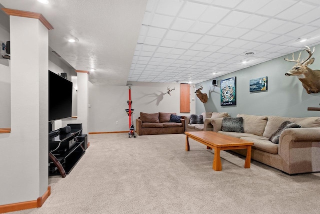 carpeted living room with baseboards