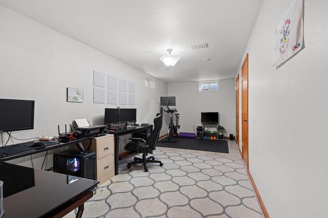 home office featuring baseboards and visible vents