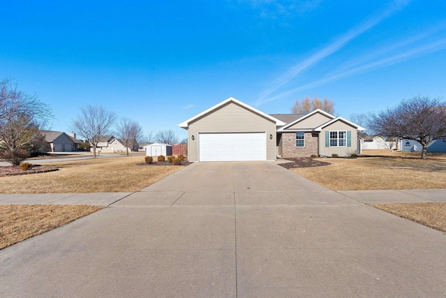 ranch-style home featuring a front lawn, concrete driveway, and a garage