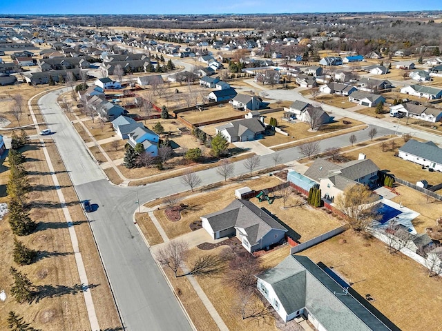 birds eye view of property with a residential view