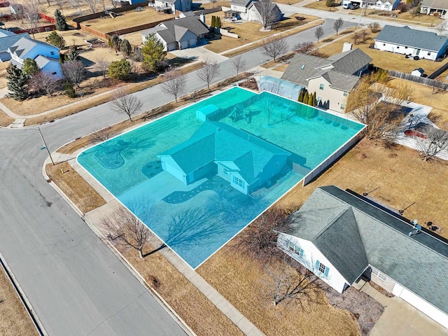 view of swimming pool featuring a residential view