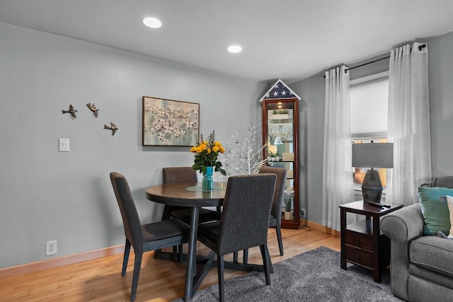 dining room featuring recessed lighting, baseboards, and wood finished floors