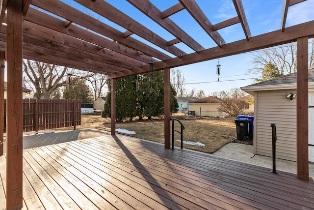 wooden deck featuring fence and a pergola