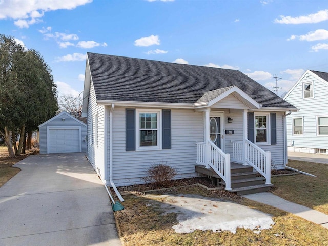 bungalow-style home with driveway, a detached garage, an outdoor structure, and roof with shingles