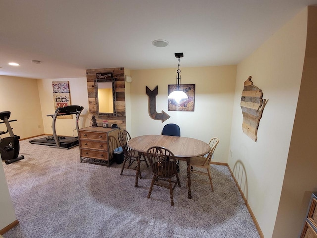 carpeted dining room featuring recessed lighting and baseboards