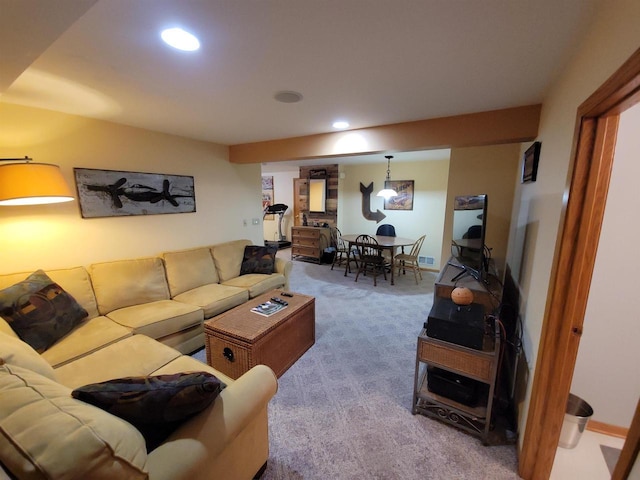 living room with recessed lighting and carpet floors