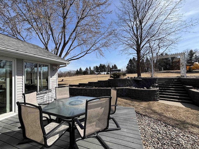 wooden deck featuring outdoor dining space