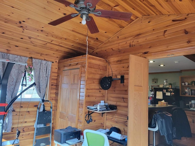 interior space featuring lofted ceiling, wood ceiling, and wood walls