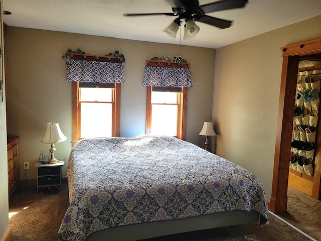 bedroom featuring a ceiling fan and carpet