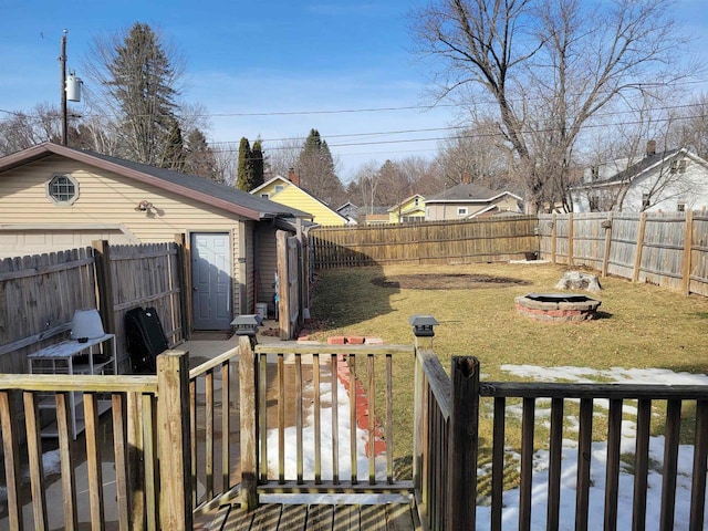 view of yard with a fire pit and a fenced backyard