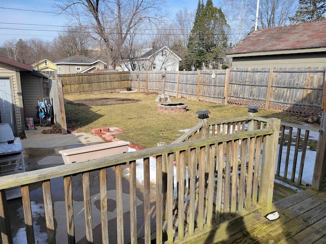 view of yard with a fire pit and a fenced backyard