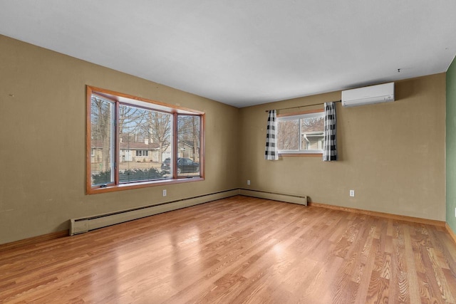 unfurnished room featuring an AC wall unit, light wood-type flooring, baseboards, and a baseboard radiator