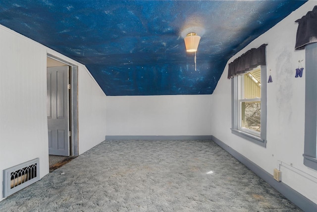 bonus room with visible vents, carpet flooring, baseboards, and lofted ceiling