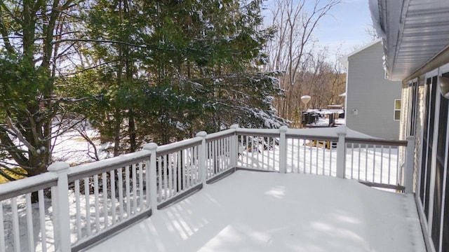 view of snow covered back of property