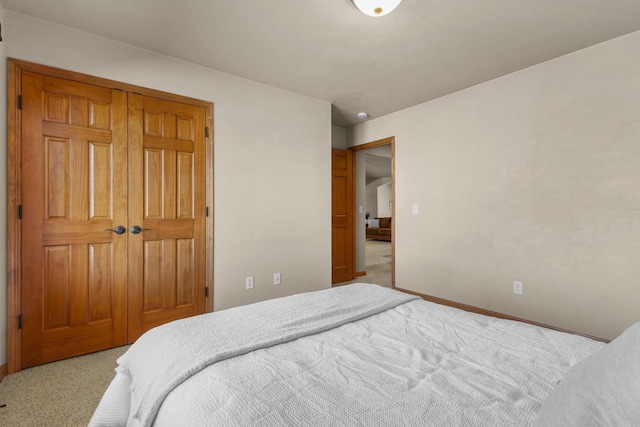 carpeted bedroom with baseboards