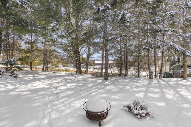 view of yard layered in snow