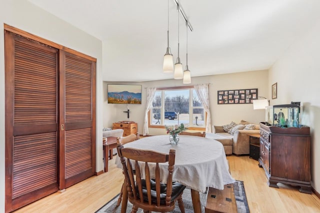 dining room featuring light wood finished floors