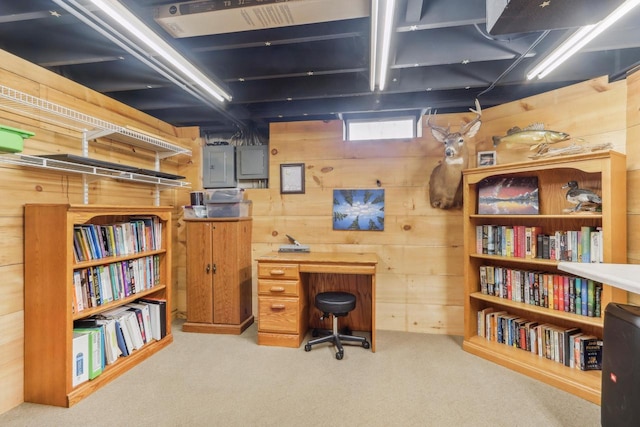 office featuring carpet and wood walls