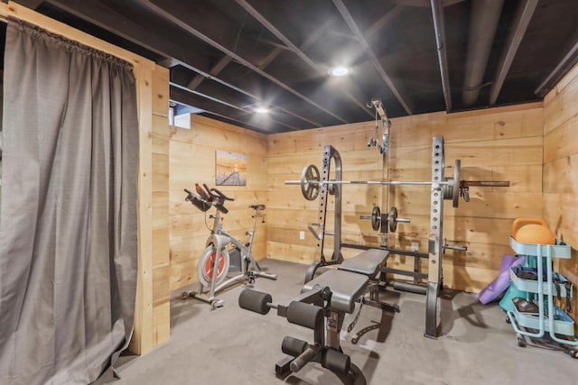 workout room with wood walls