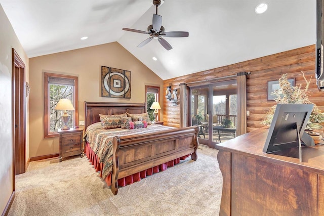 bedroom with rustic walls, multiple windows, and access to outside