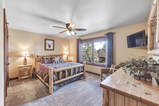 bedroom featuring ceiling fan, baseboards, and carpet floors