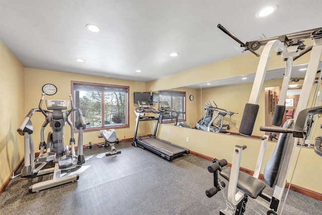 workout room featuring recessed lighting and baseboards