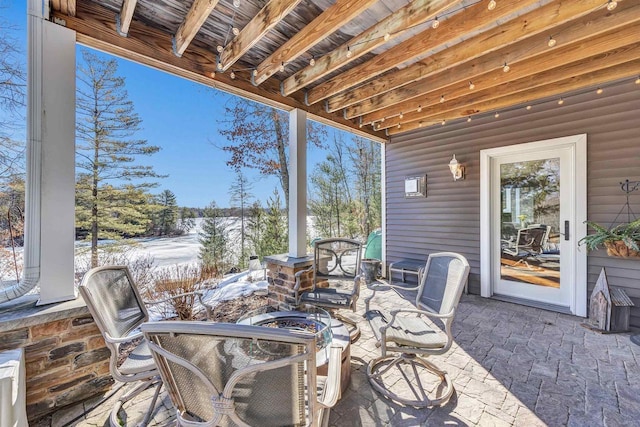 view of snow covered patio