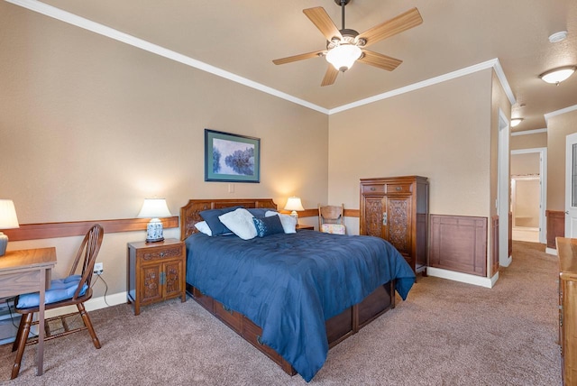 carpeted bedroom with ceiling fan, a wainscoted wall, and ornamental molding