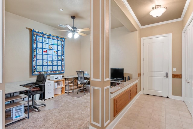 office area featuring visible vents, crown molding, light tile patterned floors, baseboards, and ceiling fan