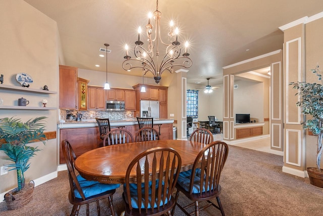 dining room featuring visible vents, light carpet, ornamental molding, and ceiling fan with notable chandelier