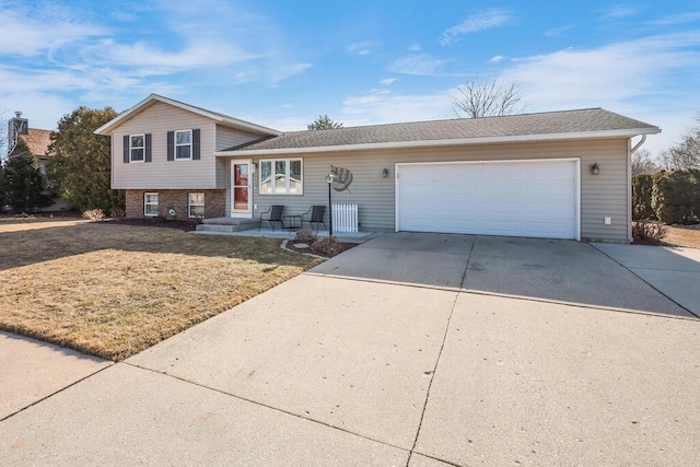 tri-level home with an attached garage and driveway