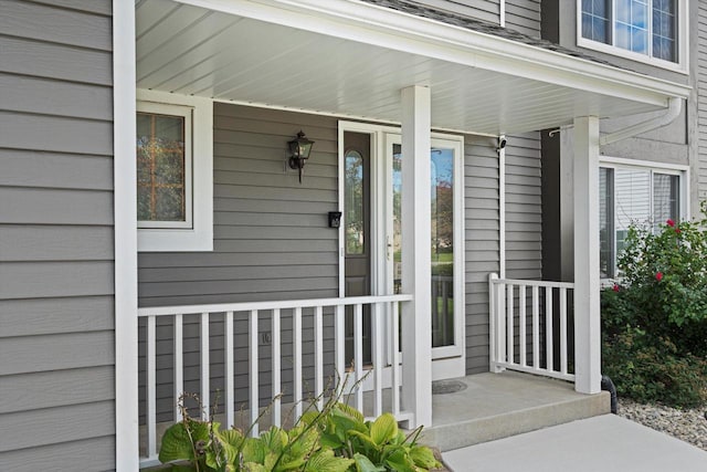 entrance to property featuring a porch