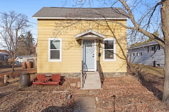 view of front of house with roof with shingles