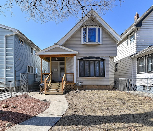 view of front of house featuring covered porch and fence