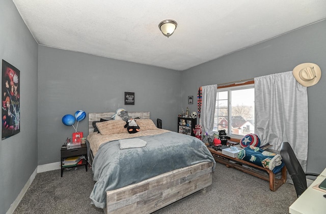 carpeted bedroom featuring baseboards