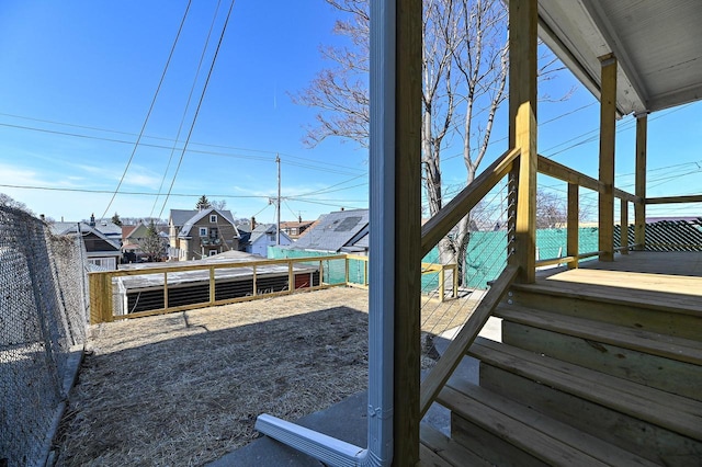 view of yard with a deck and fence