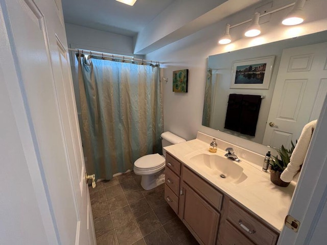 full bath featuring tile patterned floors, curtained shower, toilet, and vanity