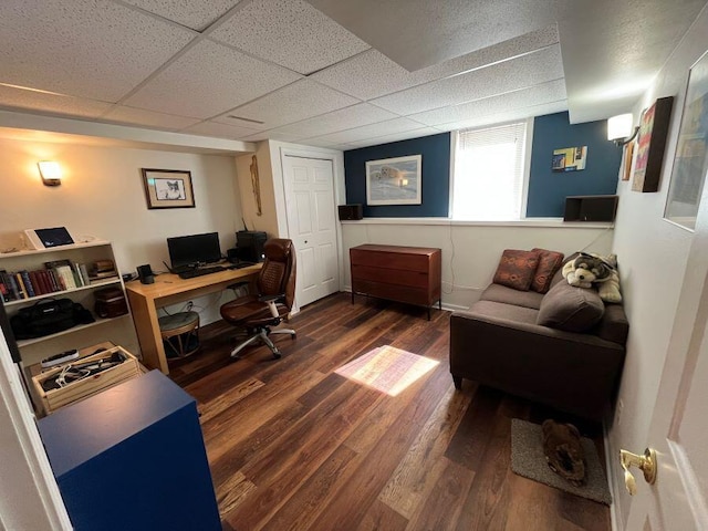 office with dark wood-style flooring and a drop ceiling